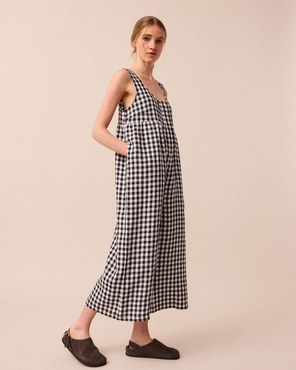 model wears black and white gingham savannah linen jumpsuit