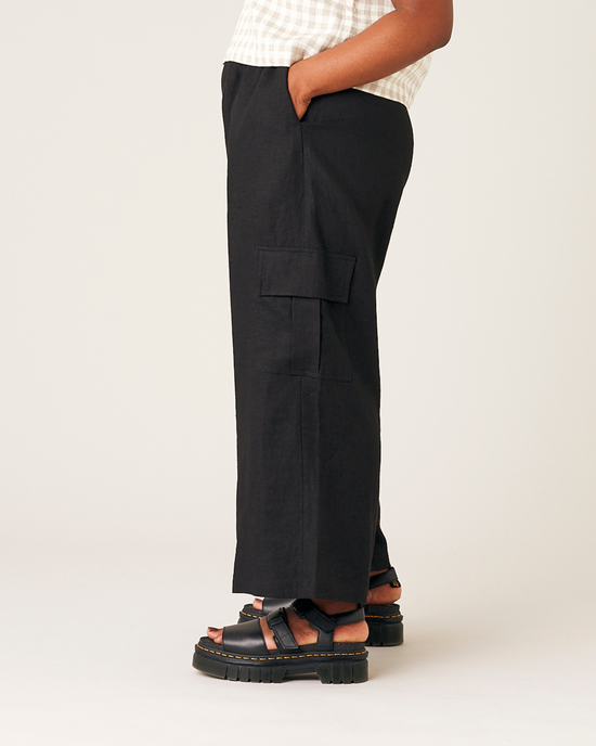 model wears black orla linen trousers left