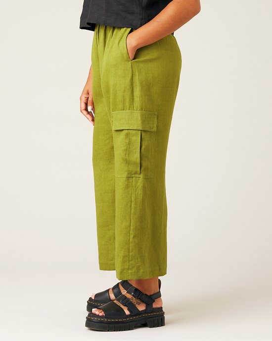 model wears pea pod linen trousers left