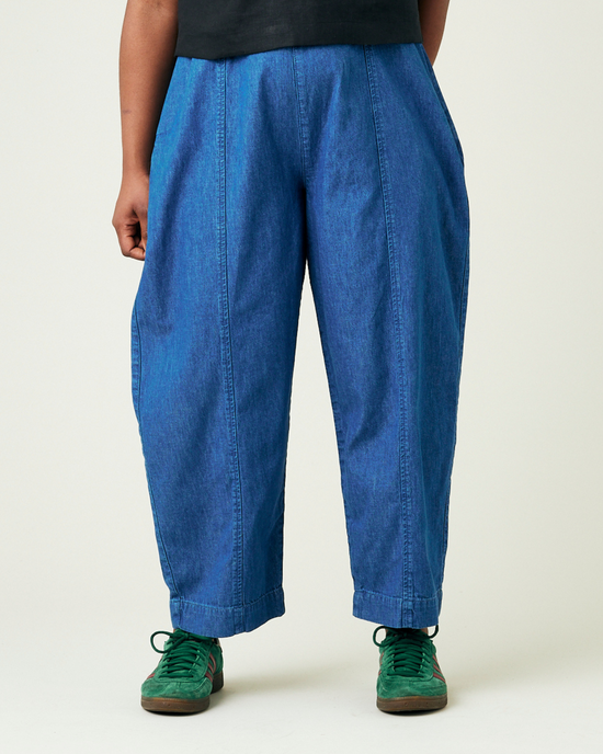 model wears mid wash chambray mabel trousers front