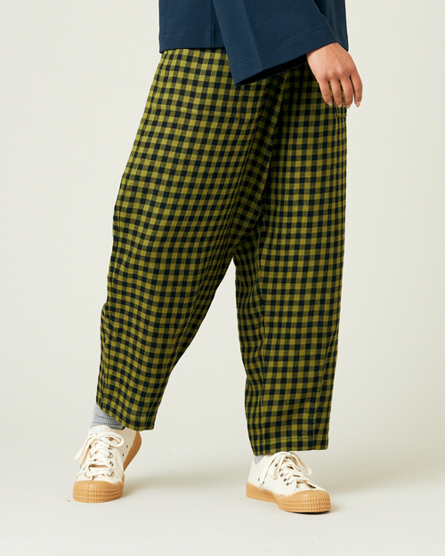 model wears green gingham huxley trousers right