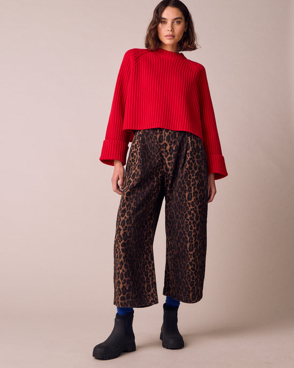 model wears cadi cherry red knitted jumper