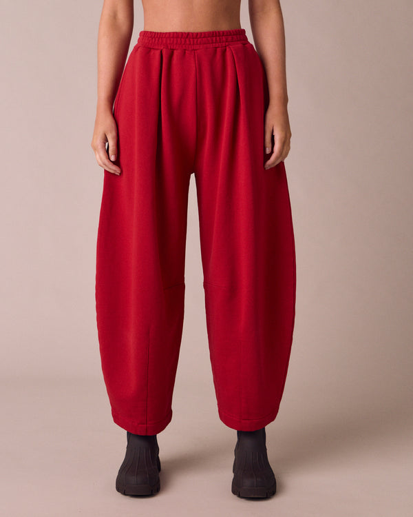 model wears daisy cherry red fleeceback jersey trousers front