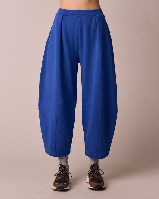 model wears daisy cobalt jersey fleeceback trousers front