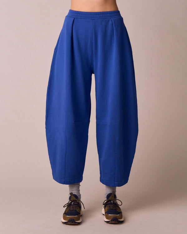 model wears daisy cobalt jersey fleeceback trousers front