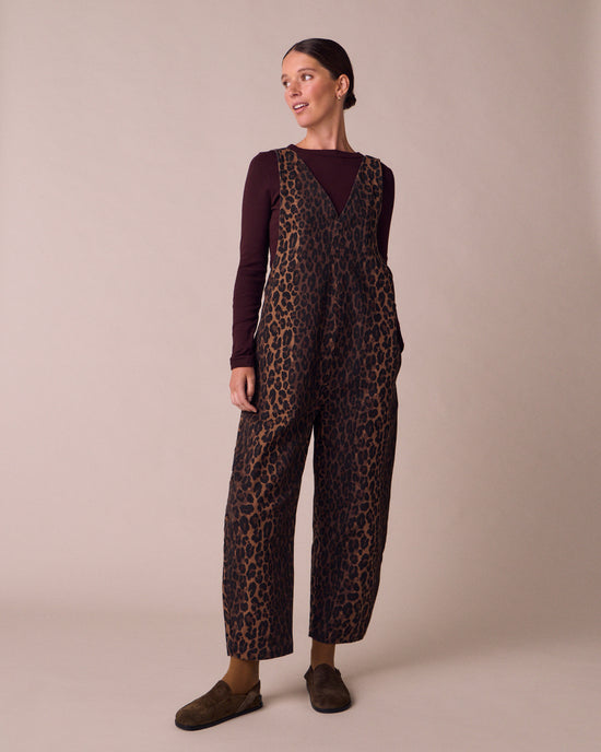 model wears ottie dark leopard denim jumpsuit