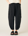 model wears black cupro sylvie trousers front