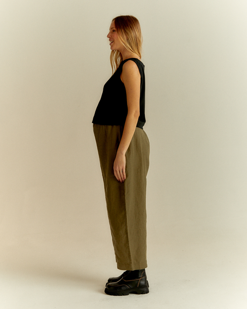 pregnant model wears khaki linen mabel trousers