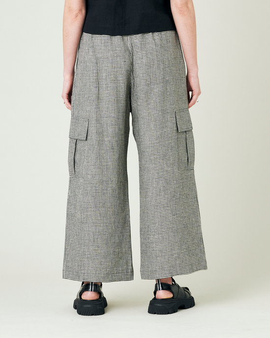 model wears black and stone micro gingham orla trousers back