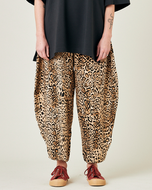 model wears leopard print cupro mabel trousers front