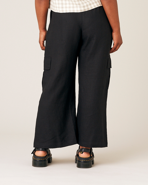 model wears black orla linen trousers back