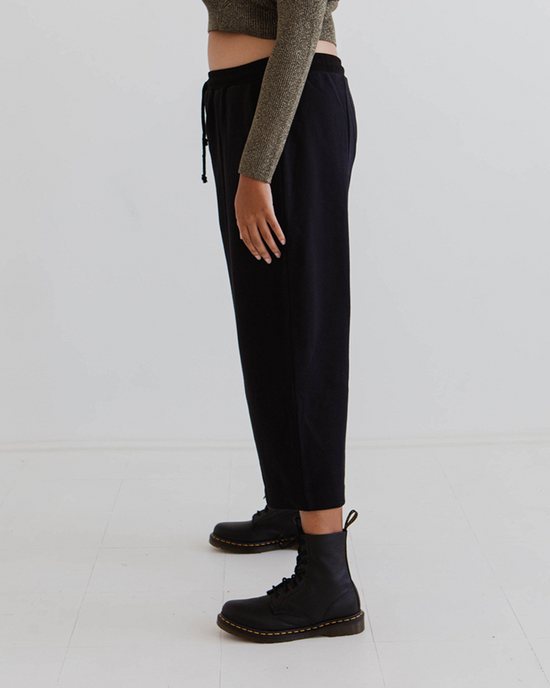 model wears black jersey jenny trousers left