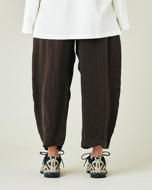 model wears espresso cupro mabel trousers back