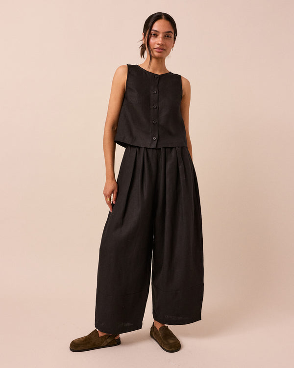 model wears black bobbi linen trousers right