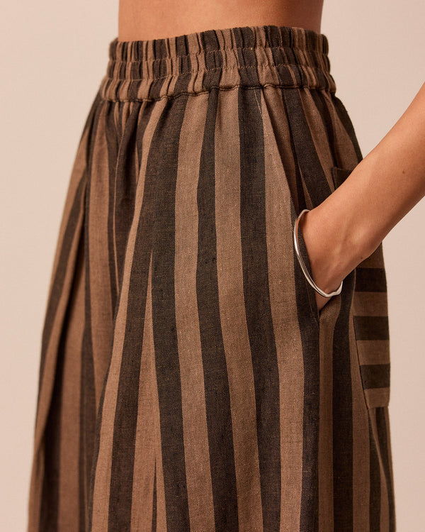 model wears walnut stripe bobbi linen trousers right
