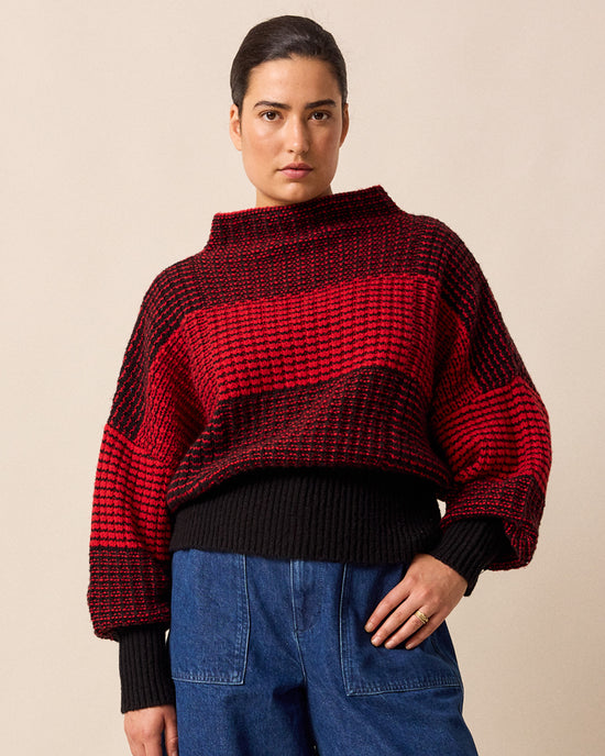model wears chelsea red and black check knitted jumper
