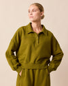 model wears cleo fresh olive jersey jumper