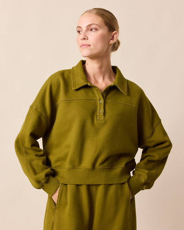 model wears cleo fresh olive jersey jumper