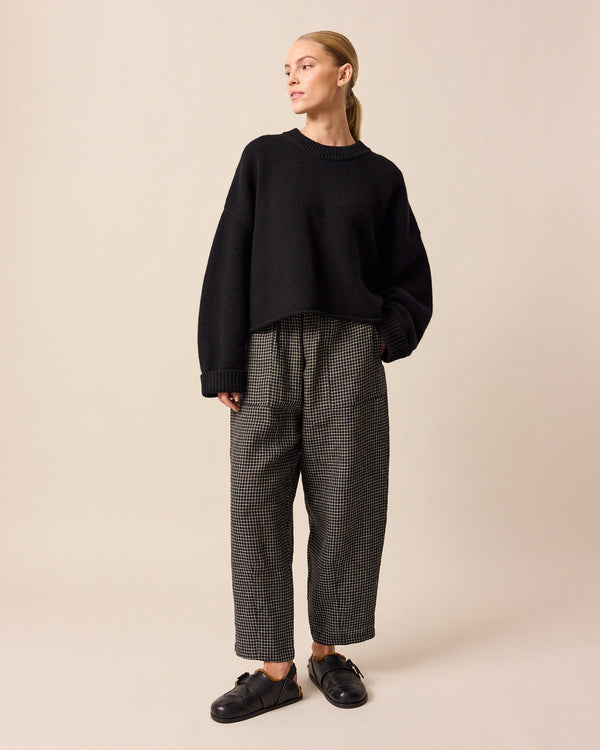 model wears coco black knitted jumper