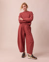 model wears daisy brick fleece jersey trousers right