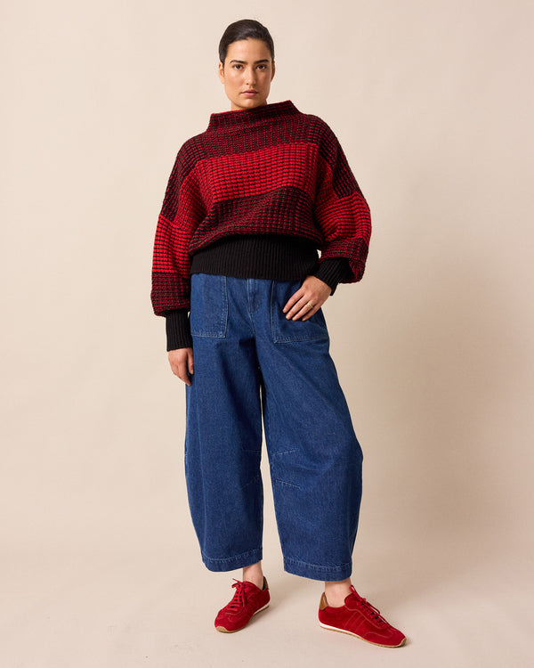 model wears dani mid blue denim jeans right