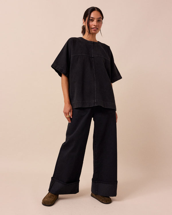 model wears deedee washed black denim top