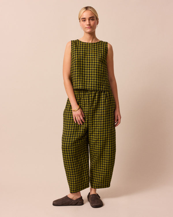 model wears green gingham linen esme top