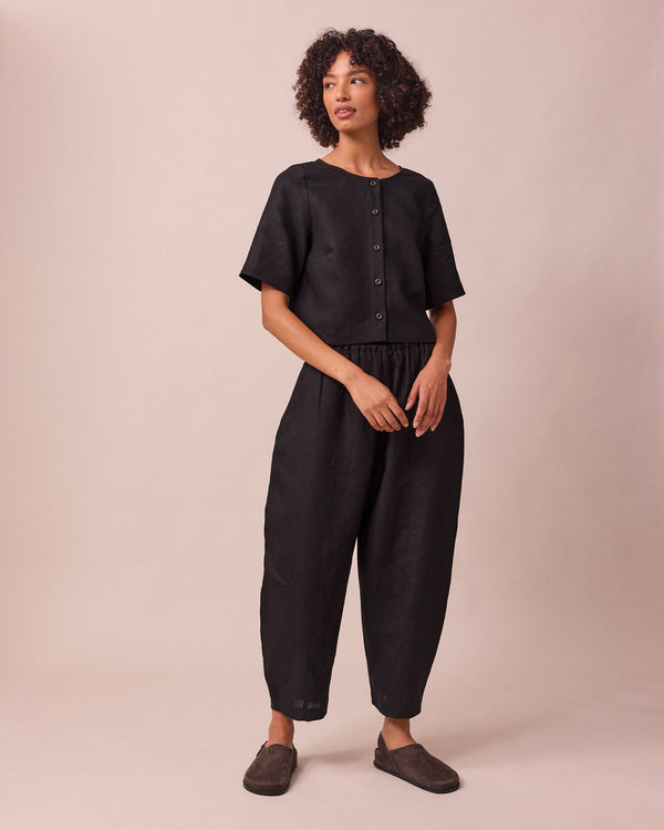model wears evelyn black linen top
