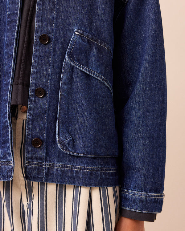 model wears dark wash denim kitty jacket