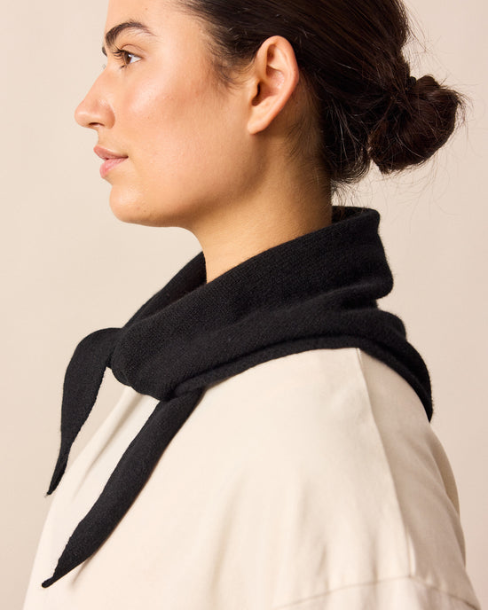 model wears black knitted neckerchief