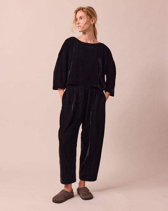 model wears lily black velvet top