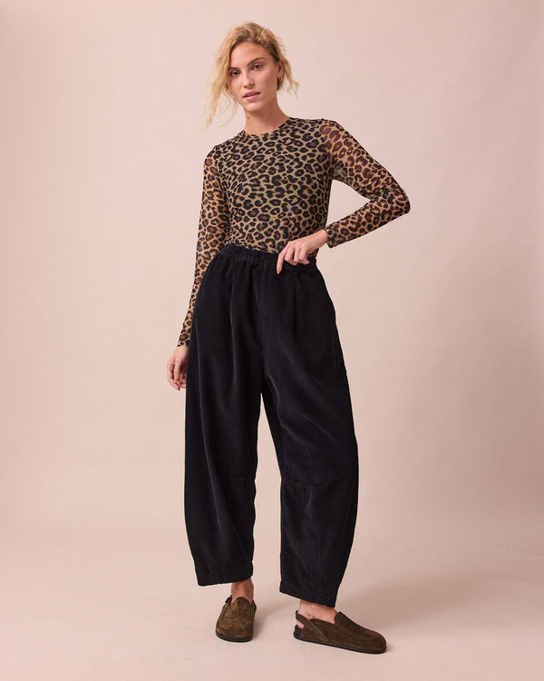 model wears mesh leopard print long sleeved top