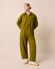 model wears lyra fresh olive jersey trousers right