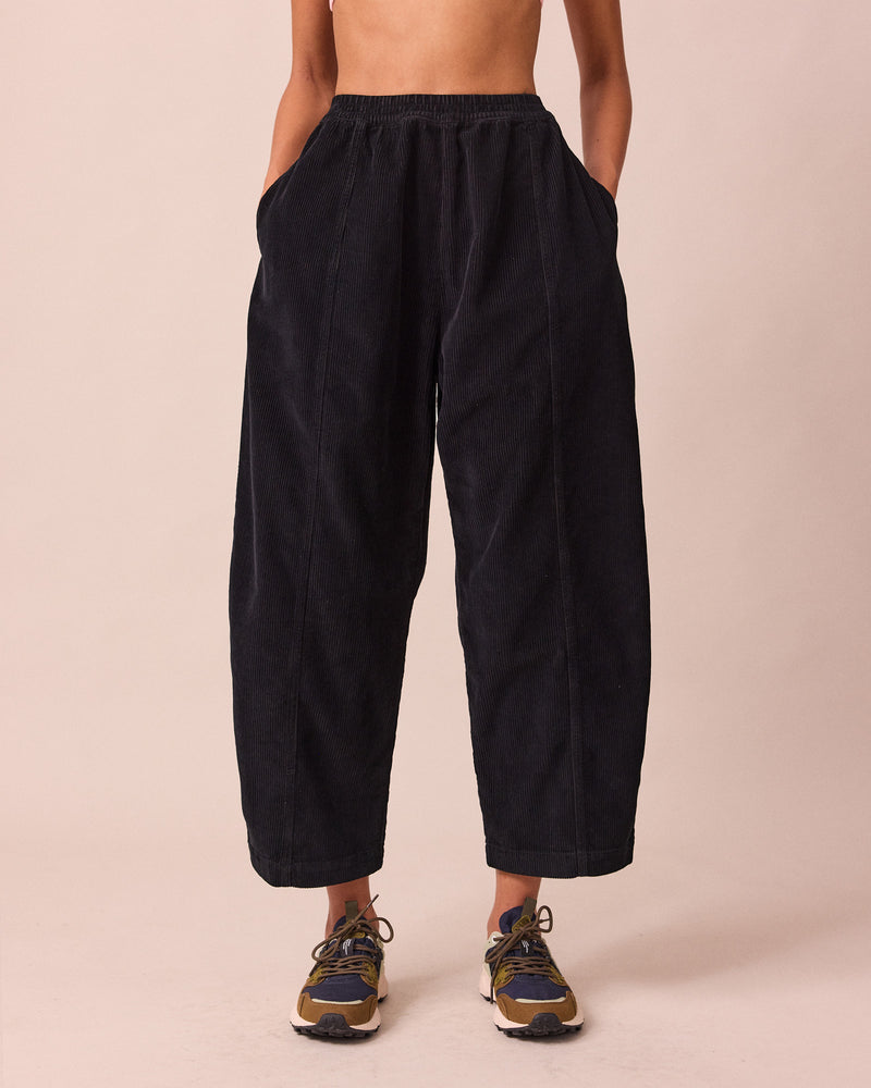 model wears mabel black cord trousers front