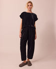 model wears mabel black velvet trousers right