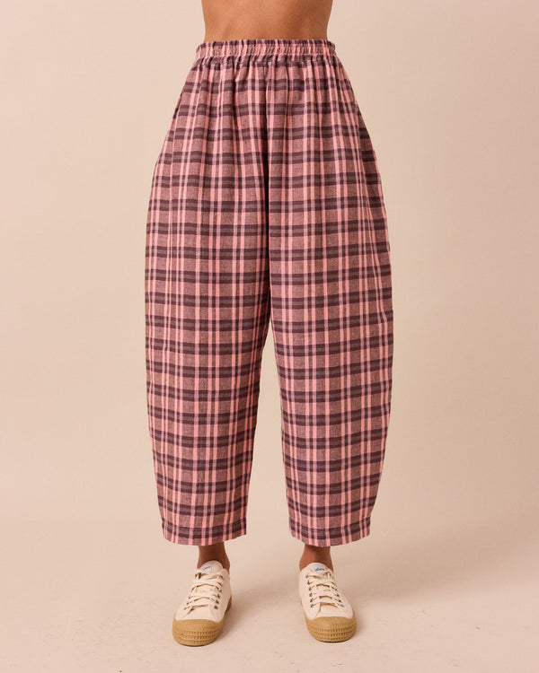 model wears mabel dewberry check linen trousers front