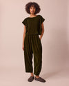 model wears mabel moss green velvet trousers right