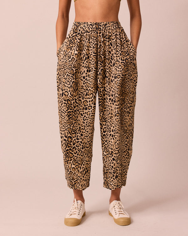 model wears mabel leopard print cupro trousers front