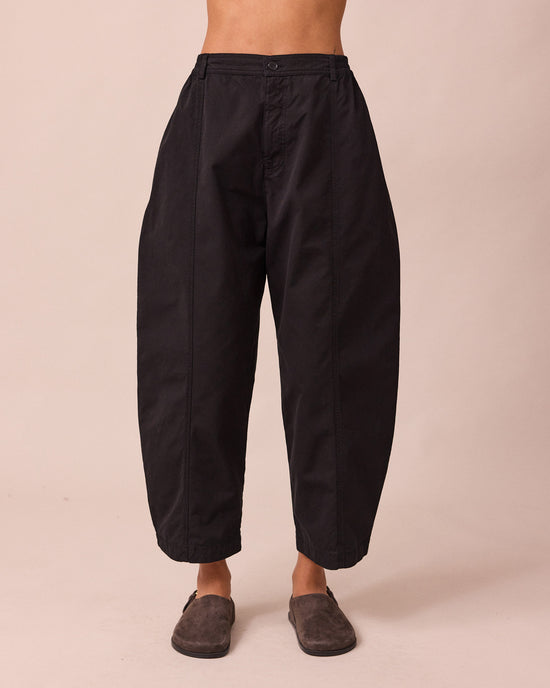 model wears millie black heavy cotton trousers front