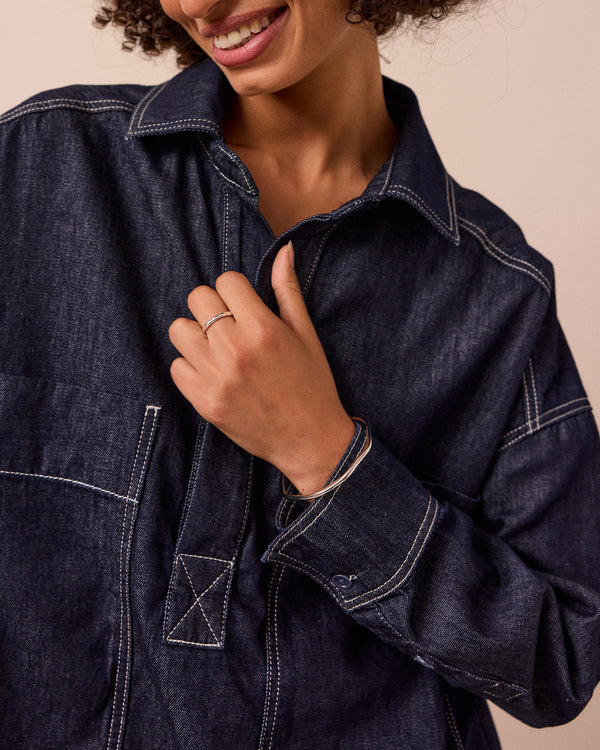 model wears olla indigo wash denim shirt