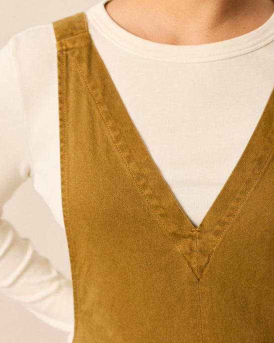 model wears ottie bronze denim jumpsuit