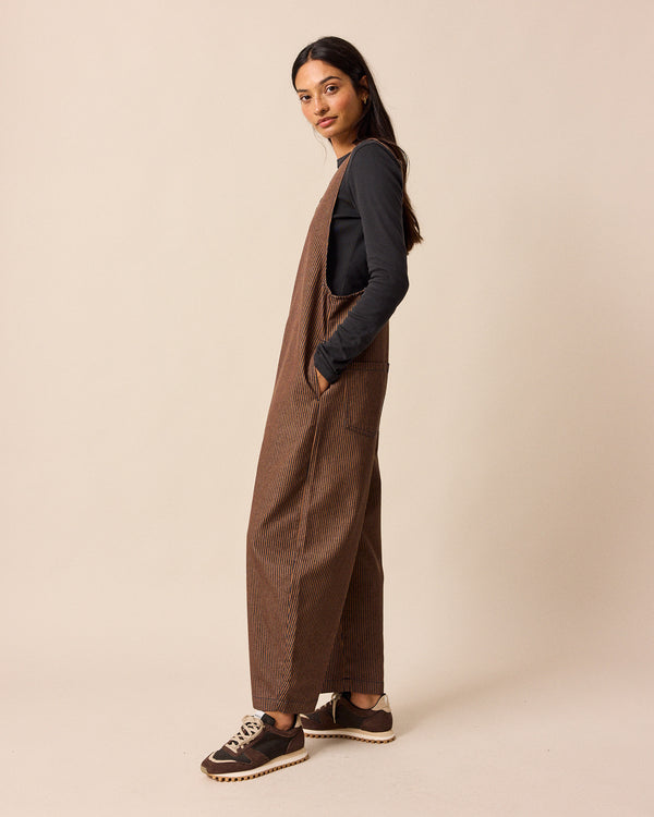 model wear ottie rust hickory stripe denim jumpsuit