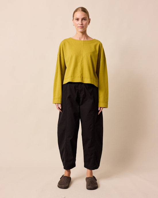 model wears peggy golden pear jersey top