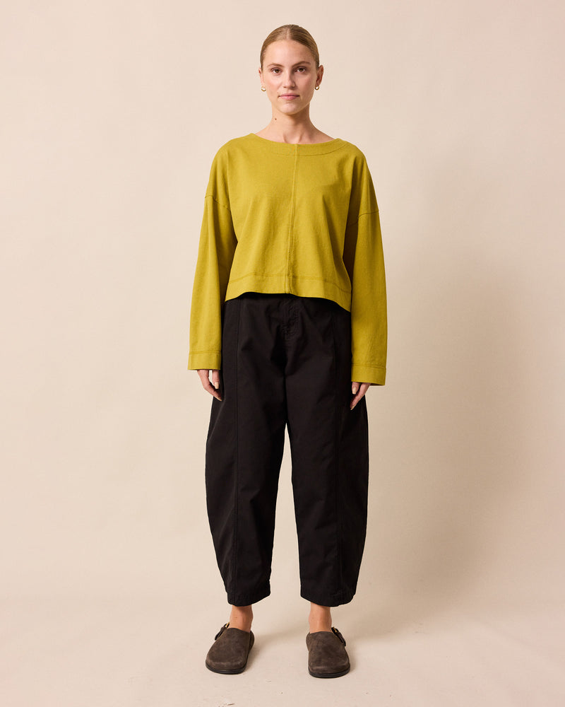 model wears peggy golden pear jersey top