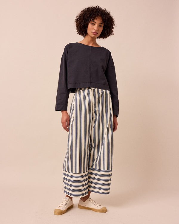 model wears peggy washed black jersey top