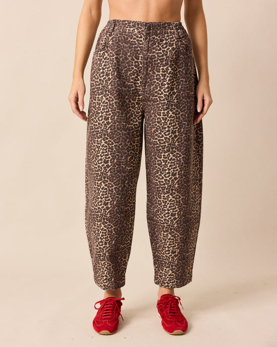 model wears remi leopard print denim jeans front