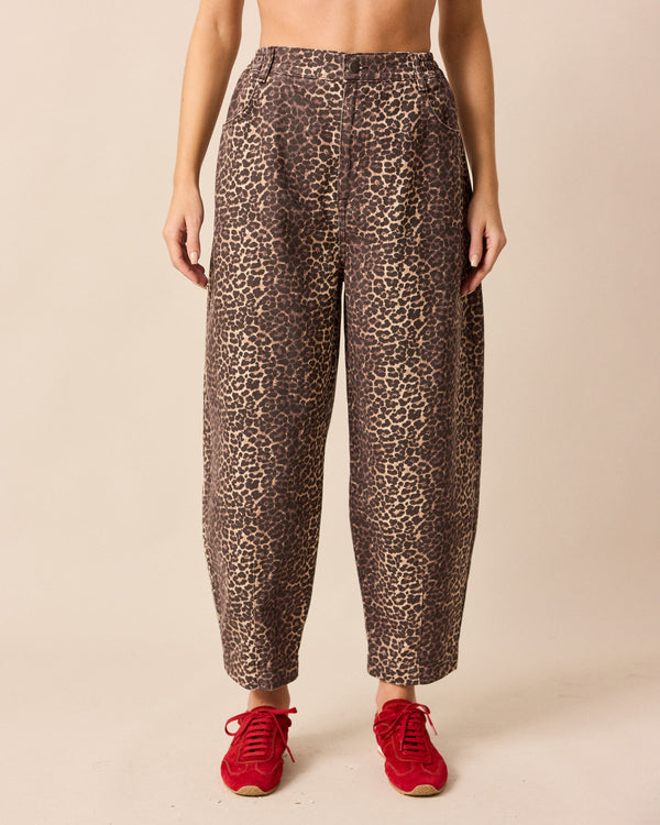 model wears remi leopard print denim jeans front