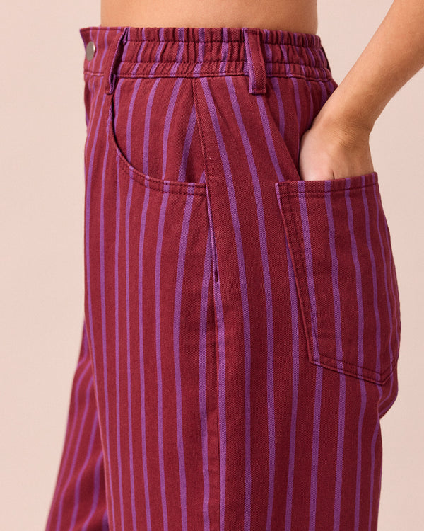 model wears remi russet and violet denim jeans 