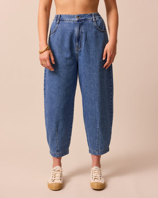 model wears remi true blue denim jeans back