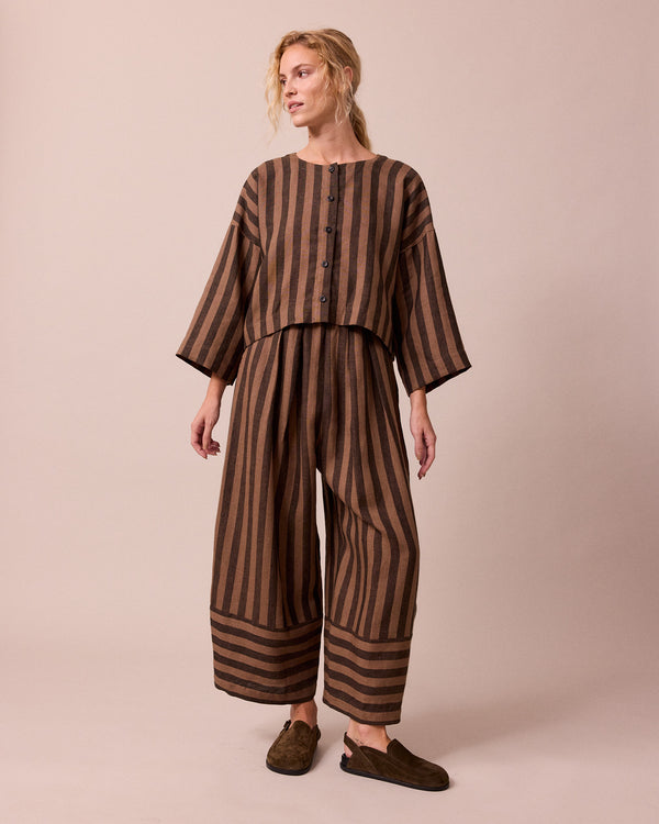 model wears romy walnut stripe linen top
